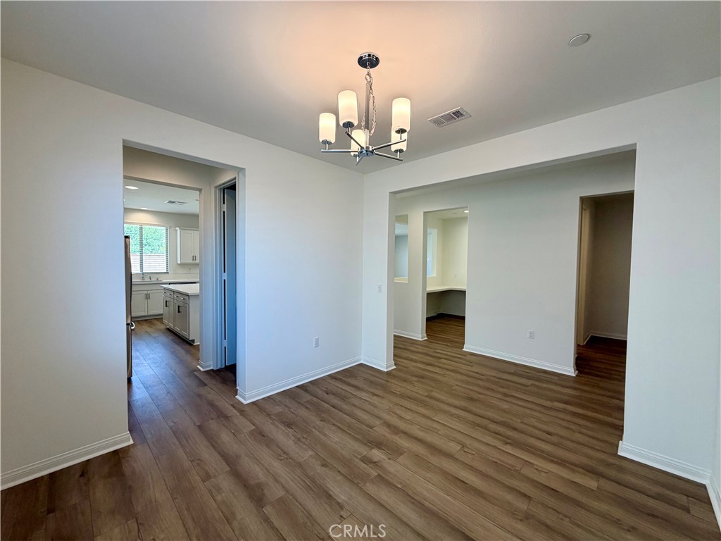 21624 Thomas Court Riverside, CA 92507 - Photo 11 of 36 wooden floor in an empty room with a window