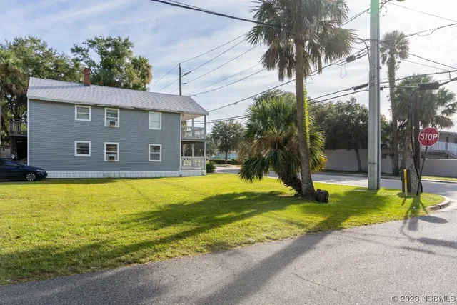 a view of a house with swimming pool and porch