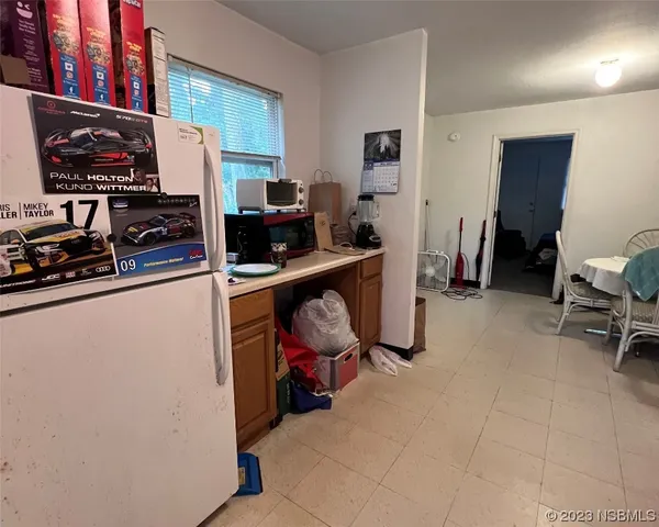 a view of a workspace with furniture