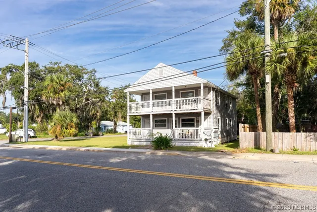 a front view of a building with street view