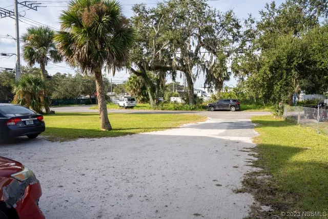 a view of a swimming pool with a house