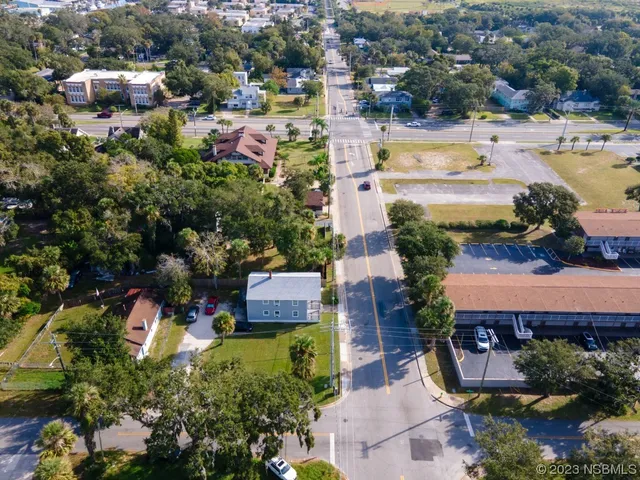 an aerial view of residential houses with outdoor space