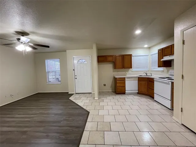 a view of a kitchen with microwave and cabinets