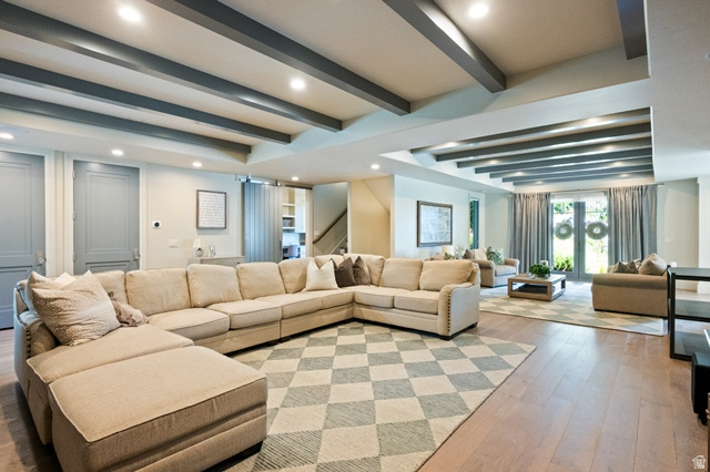 3 Carriagewood Cove, Unit 1088 Sandy, UT 84092 - Photo 52 of 79 Spacious living area featuring wood-finish flooring, recessed lighting, and exposed ceiling beams