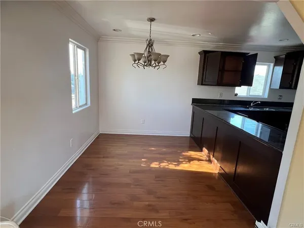 a view of a kitchen with a sink stainless steel appliances and cabinets