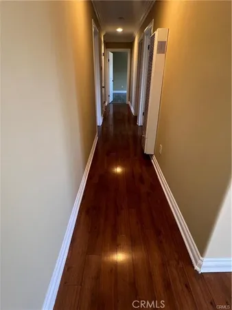 a view of gallery with wooden floor