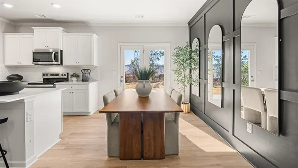 a kitchen with stainless steel appliances a sink stove and refrigerator