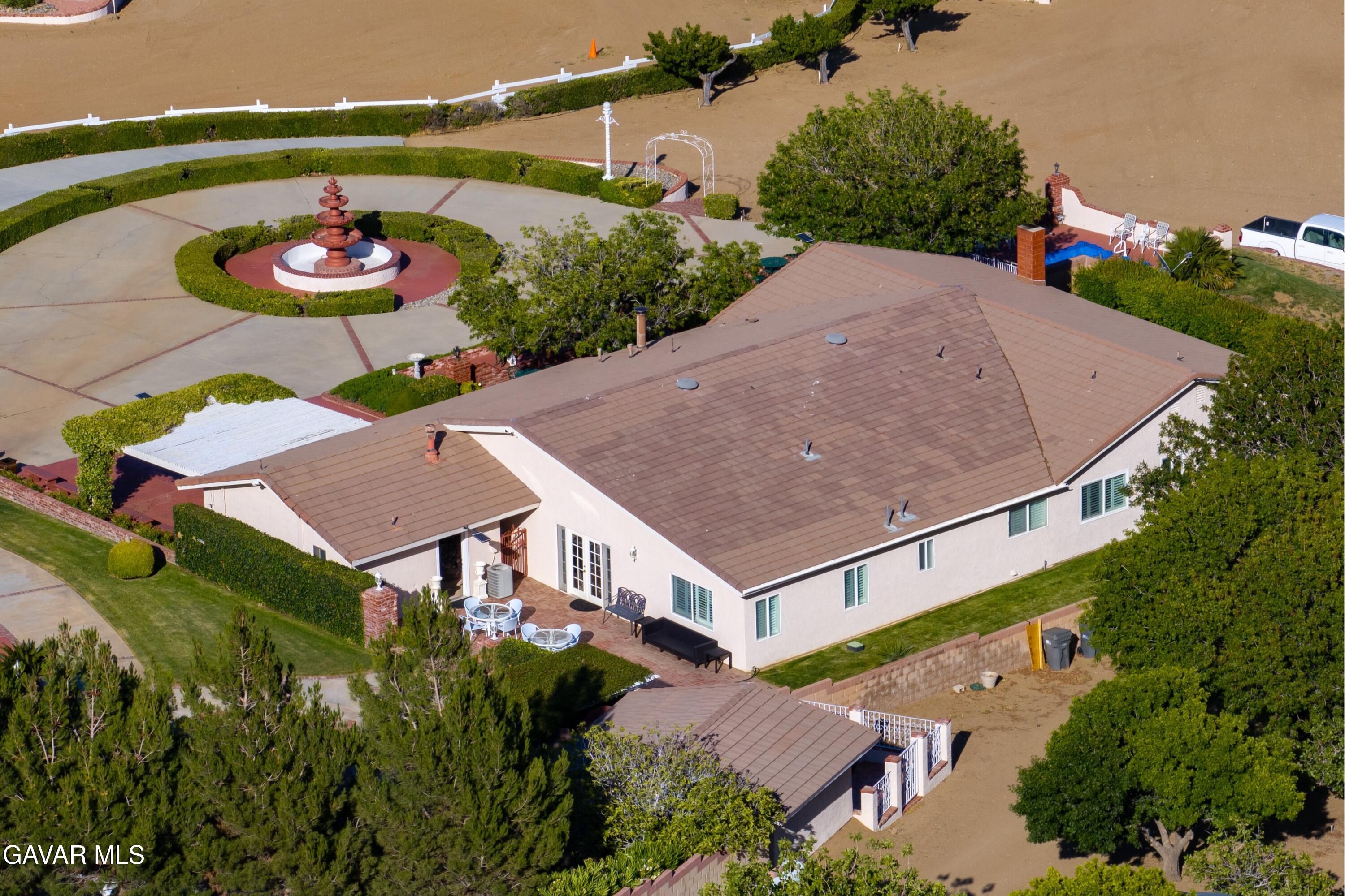 5801 Hacienda Ranch Road Palmdale, CA 93551 - Photo 56 of 69 an aerial view of a house with a swimming pool and a yard