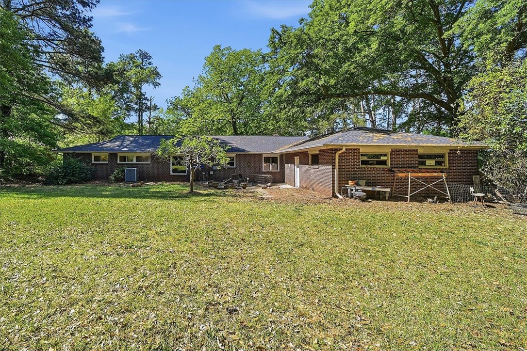 504 Jeb Stuart Avenue Anderson, SC 29621 - Photo 41 of 47 This ranch-style home features classic brick construction and a spacious private yard, surrounded by mature trees.