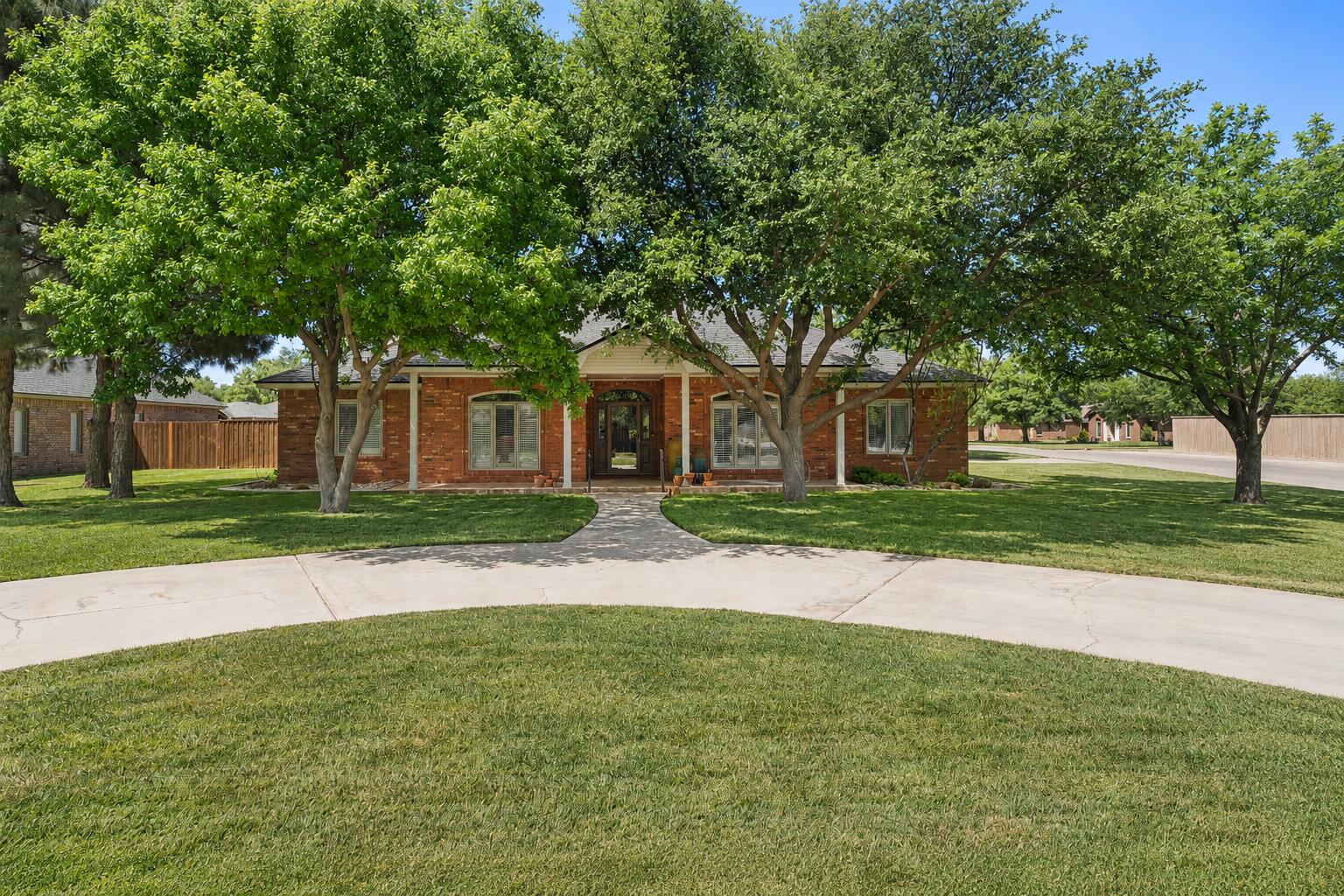 7402 95th Street Lubbock, TX 79424 - Photo 1 of 43 a view of road with trees