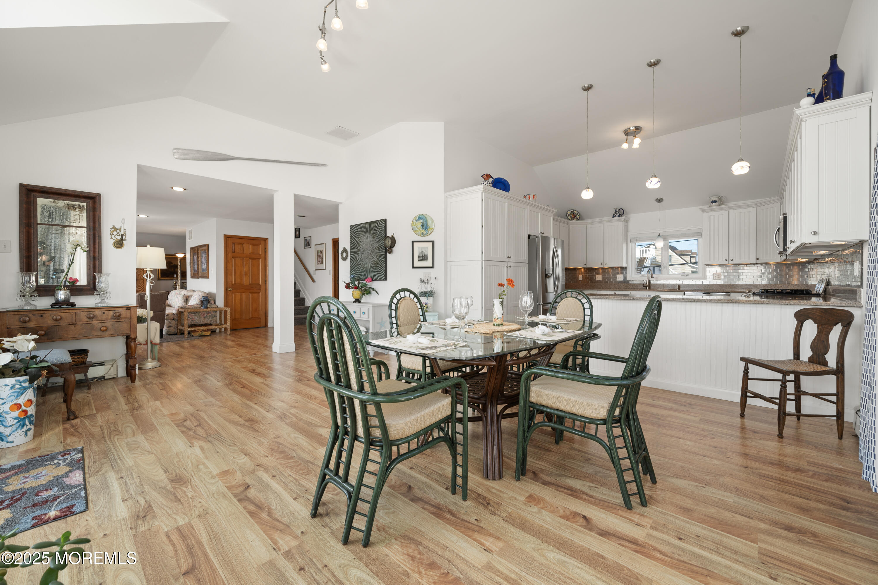 76 Sheridan Street Waretown, NJ 08758 - Photo 11 of 51 a view of a dining room with furniture and wooden floor