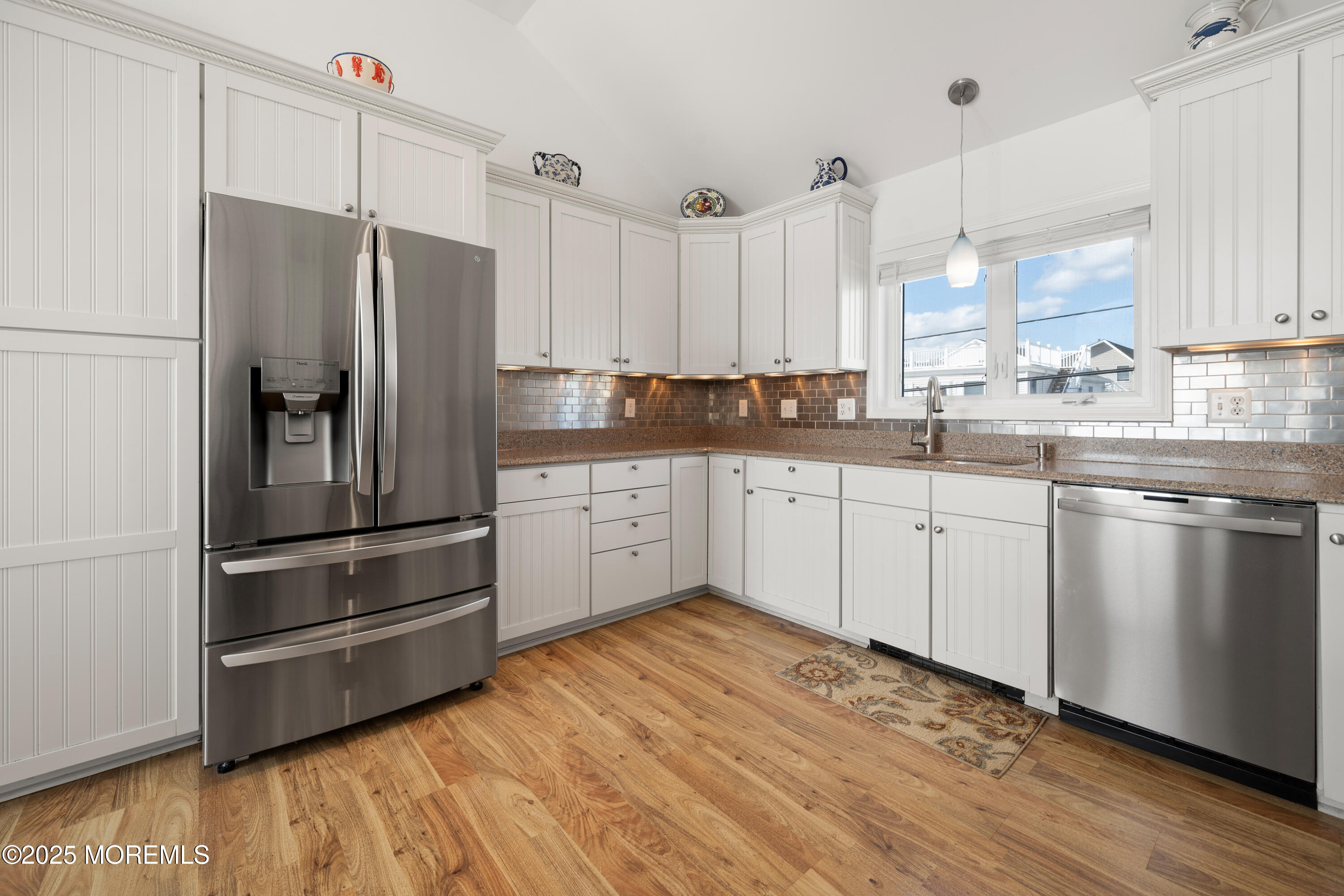 76 Sheridan Street Waretown, NJ 08758 - Photo 17 of 51 a kitchen with stainless steel appliances a refrigerator sink and cabinets