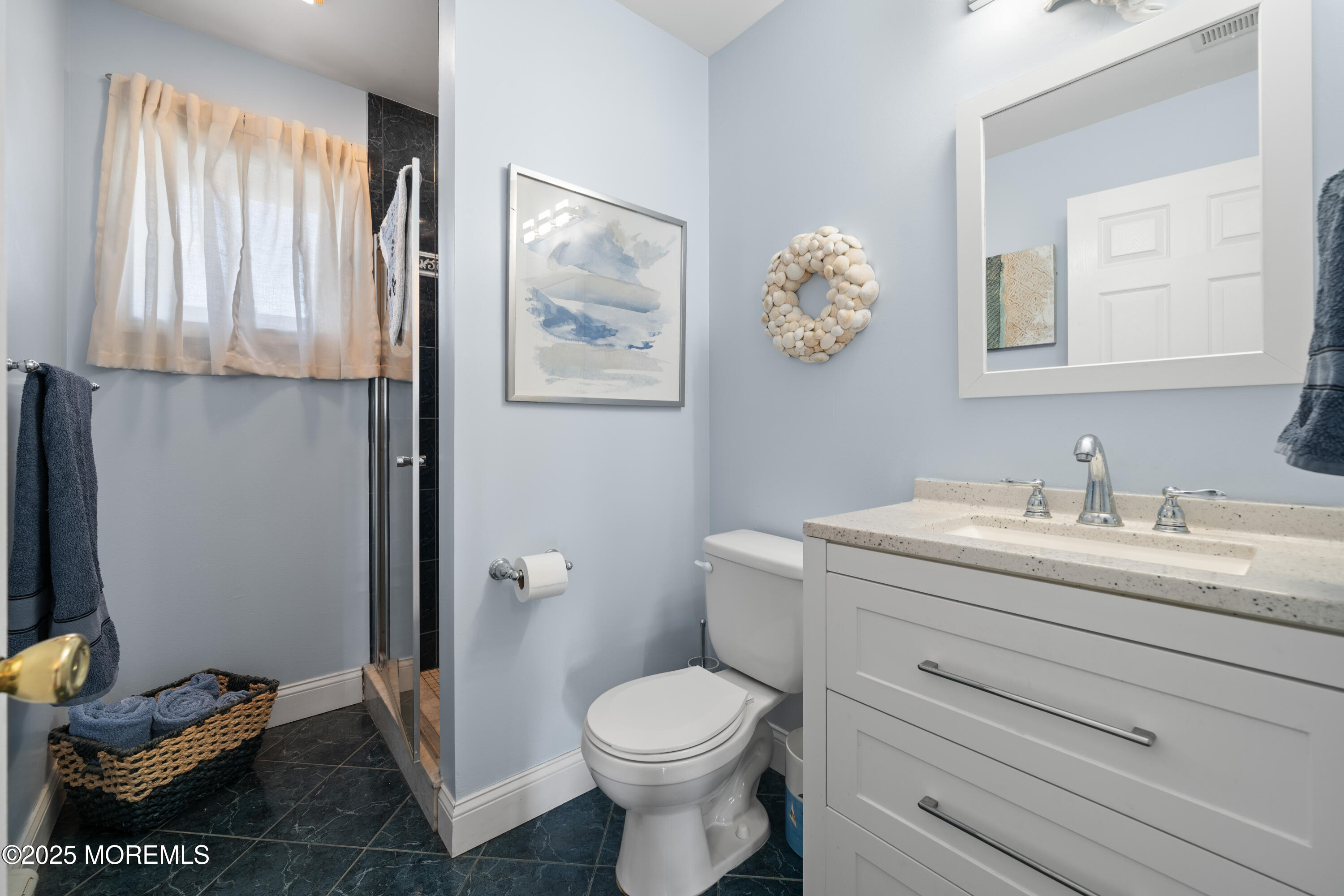 76 Sheridan Street Waretown, NJ 08758 - Photo 22 of 51 a bathroom with a toilet a sink and mirror