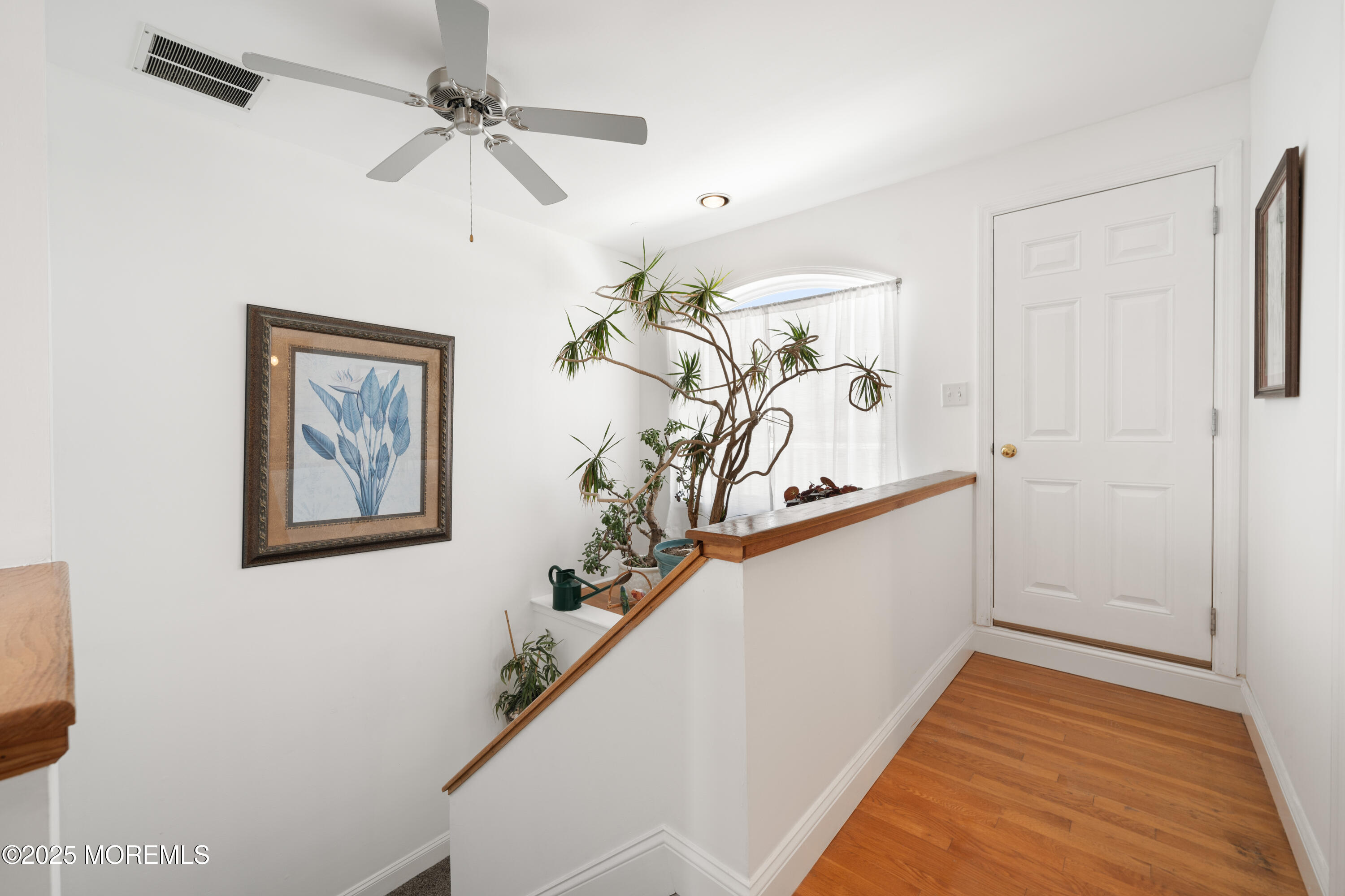 76 Sheridan Street Waretown, NJ 08758 - Photo 23 of 51 a view of a hallway with stairs and a chandelier