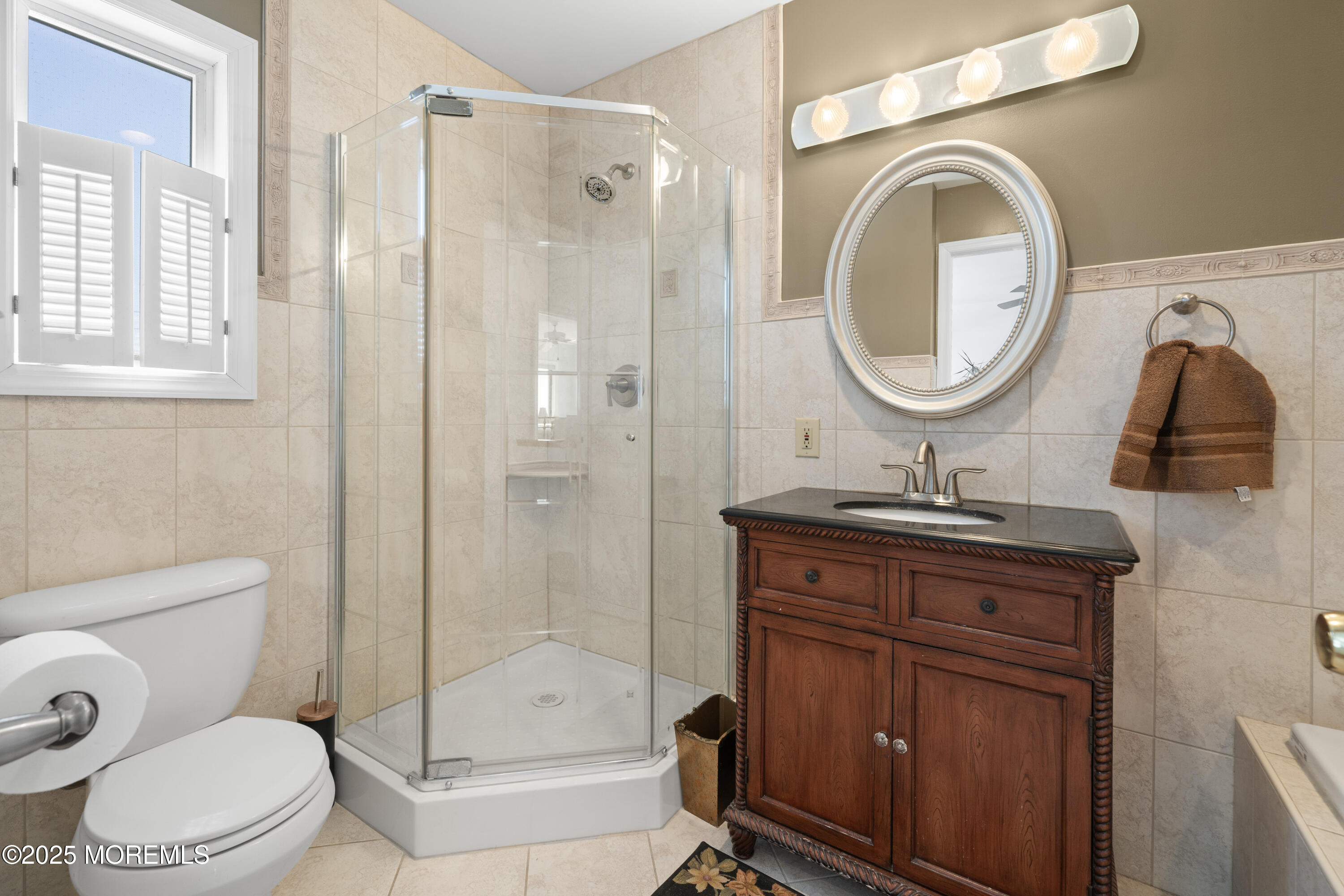 76 Sheridan Street Waretown, NJ 08758 - Photo 25 of 51 a bathroom with a granite countertop sink a toilet and a shower