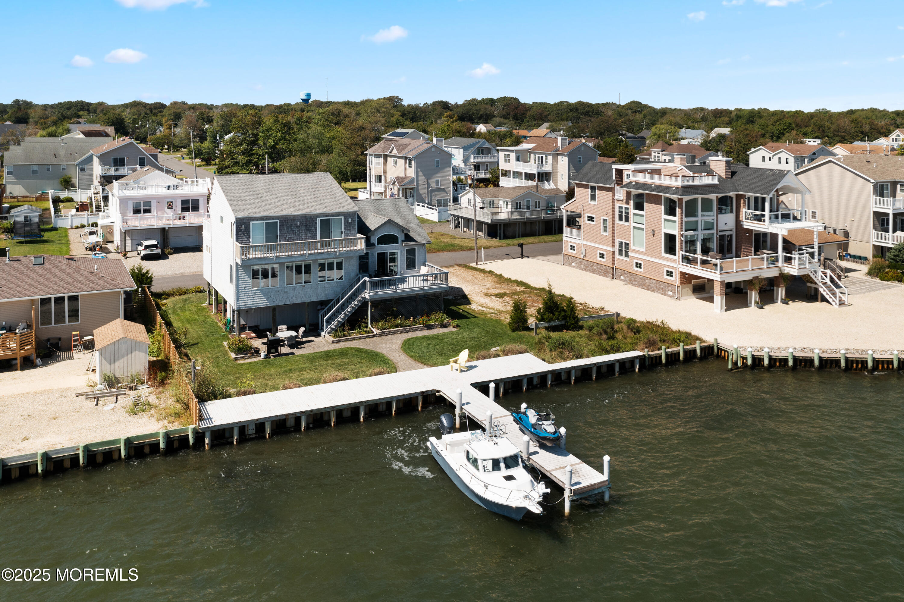 76 Sheridan Street Waretown, NJ 08758 - Photo 3 of 51 a view of a lake with houses