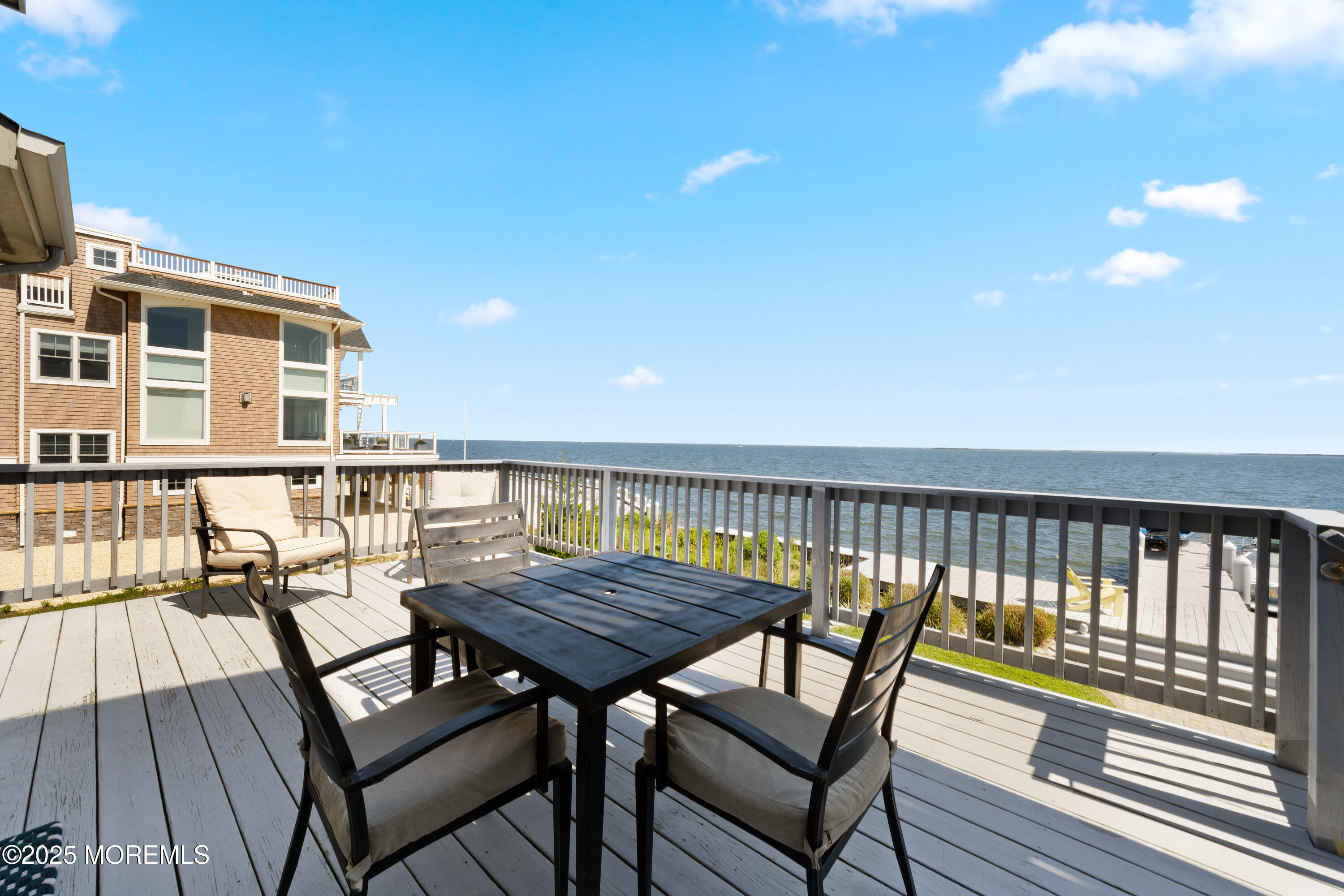 76 Sheridan Street Waretown, NJ 08758 - Photo 38 of 51 a view of a balcony with wooden floor and outdoor seating