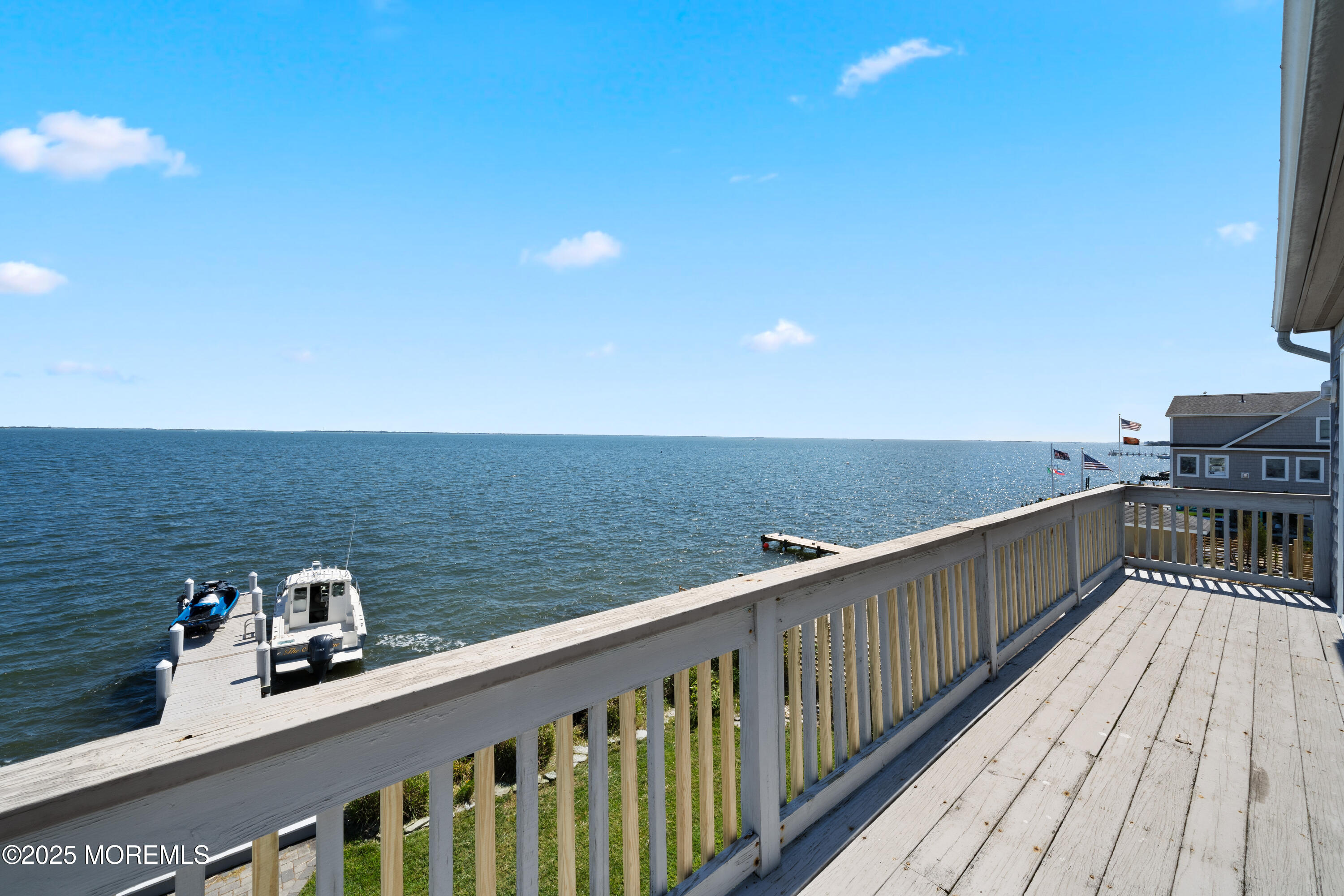 76 Sheridan Street Waretown, NJ 08758 - Photo 41 of 51 a view of roof deck with two chairs and wooden floor
