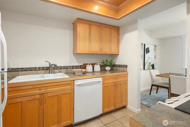 a kitchen with stainless steel appliances granite countertop a sink and cabinets