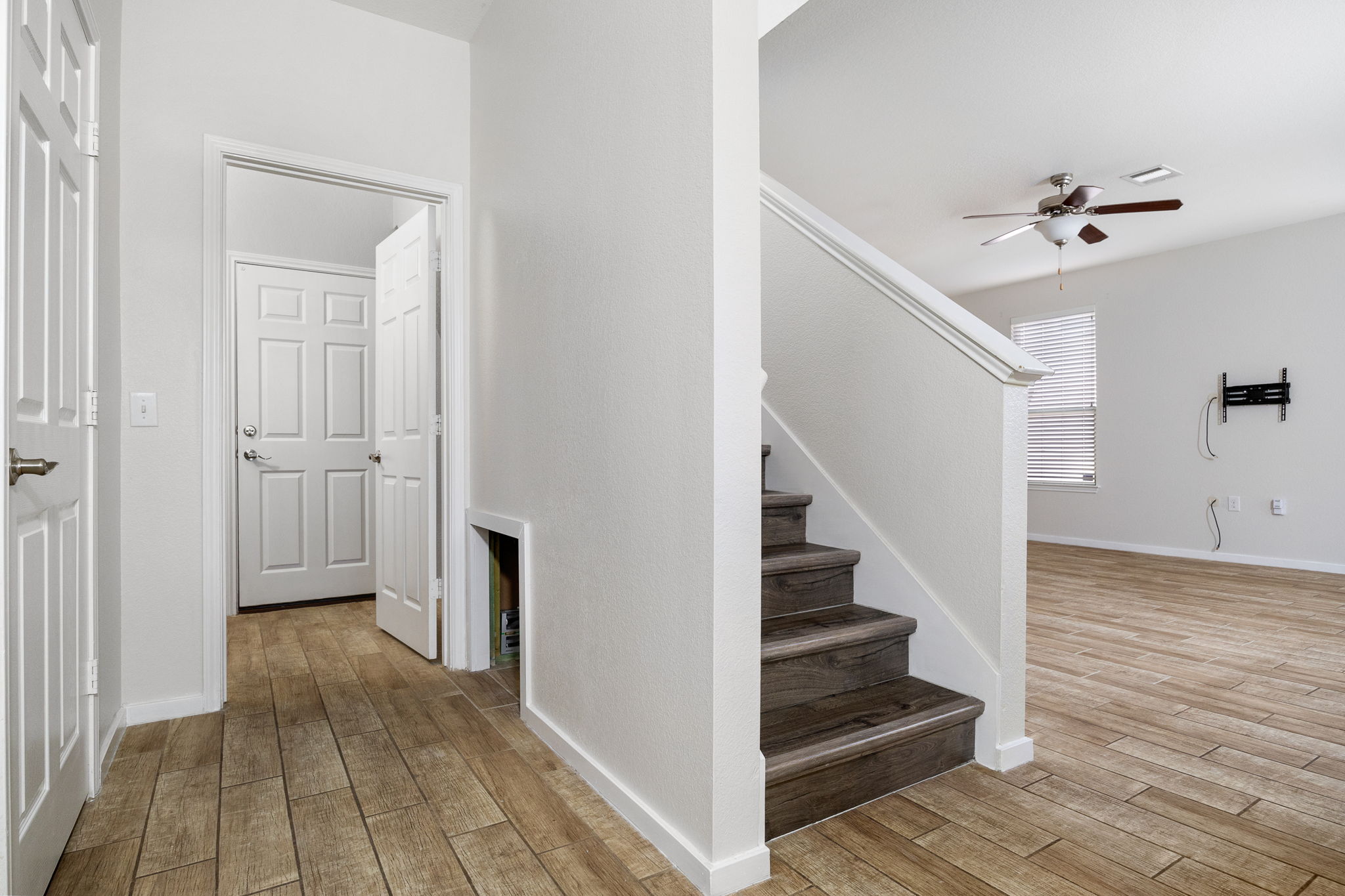 8909 Winter Haven Road Austin, TX 78747 - Photo 21 of 37 a view of a hallway with wooden floor and staircase