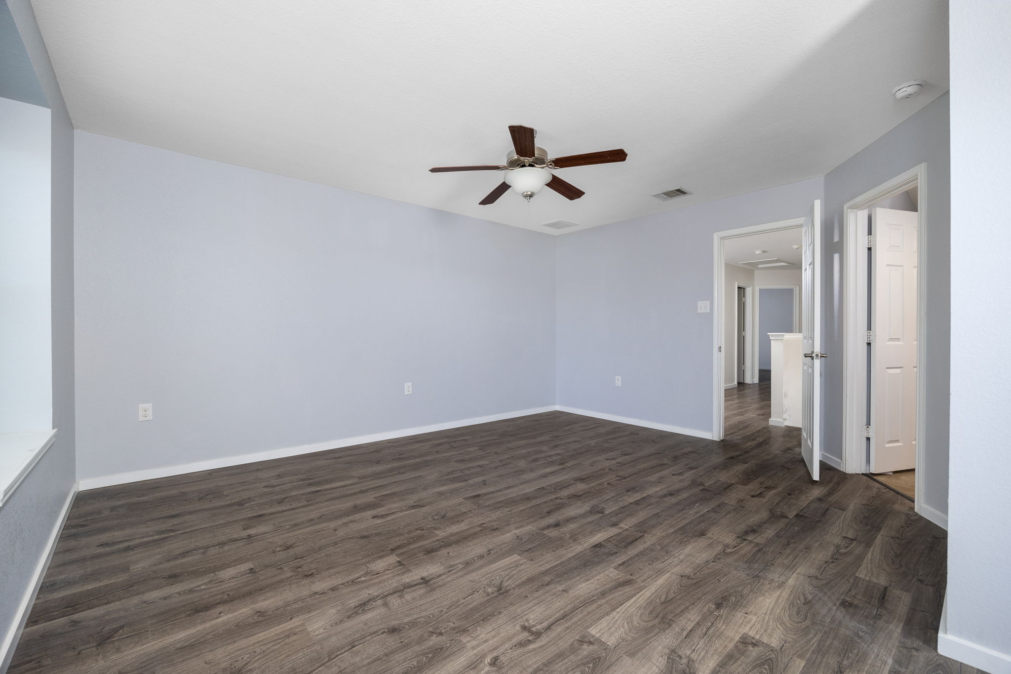 8909 Winter Haven Road Austin, TX 78747 - Photo 28 of 37 wooden floor in an empty room