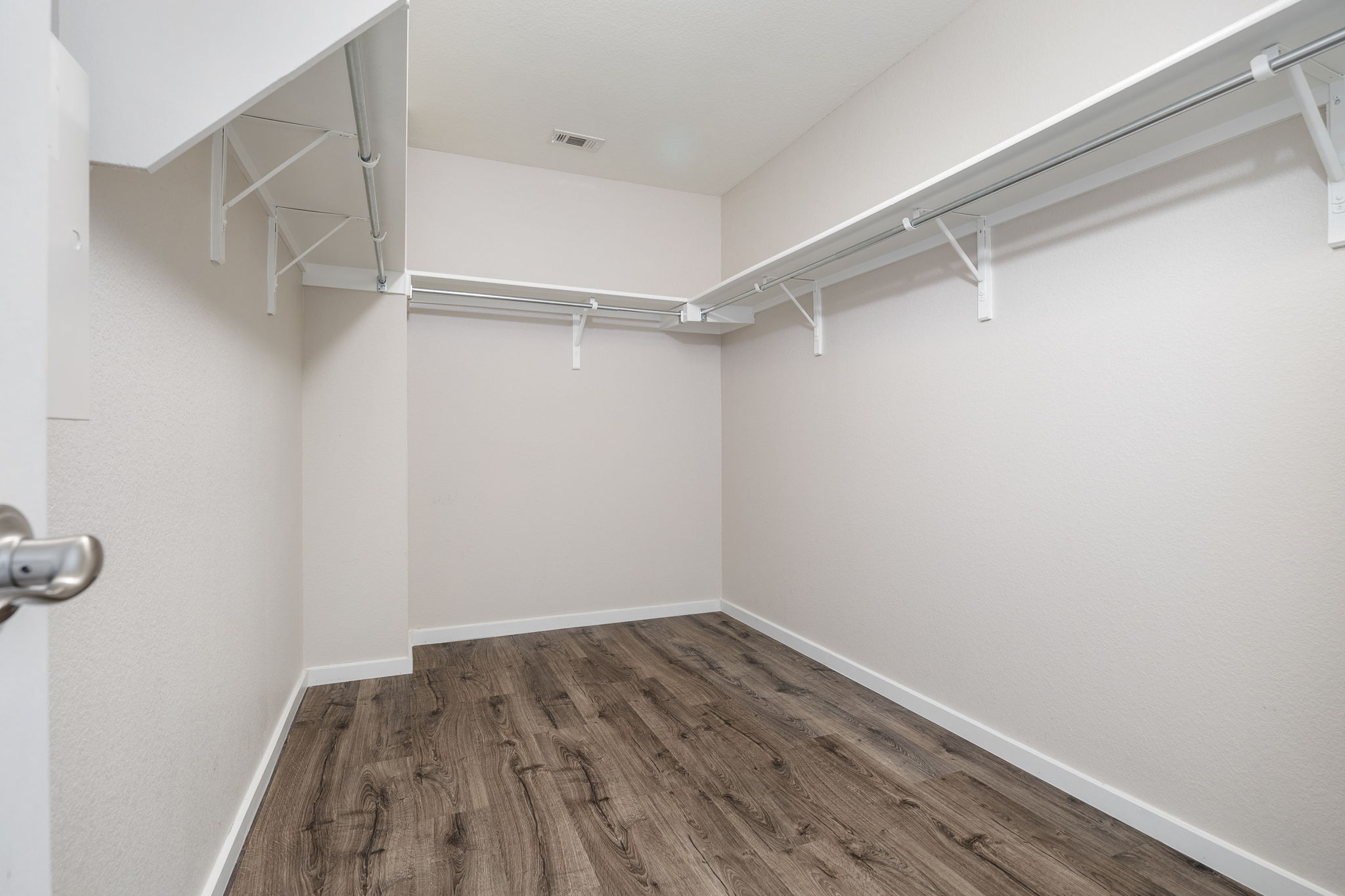 8909 Winter Haven Road Austin, TX 78747 - Photo 32 of 37 a view of a room with wooden floor