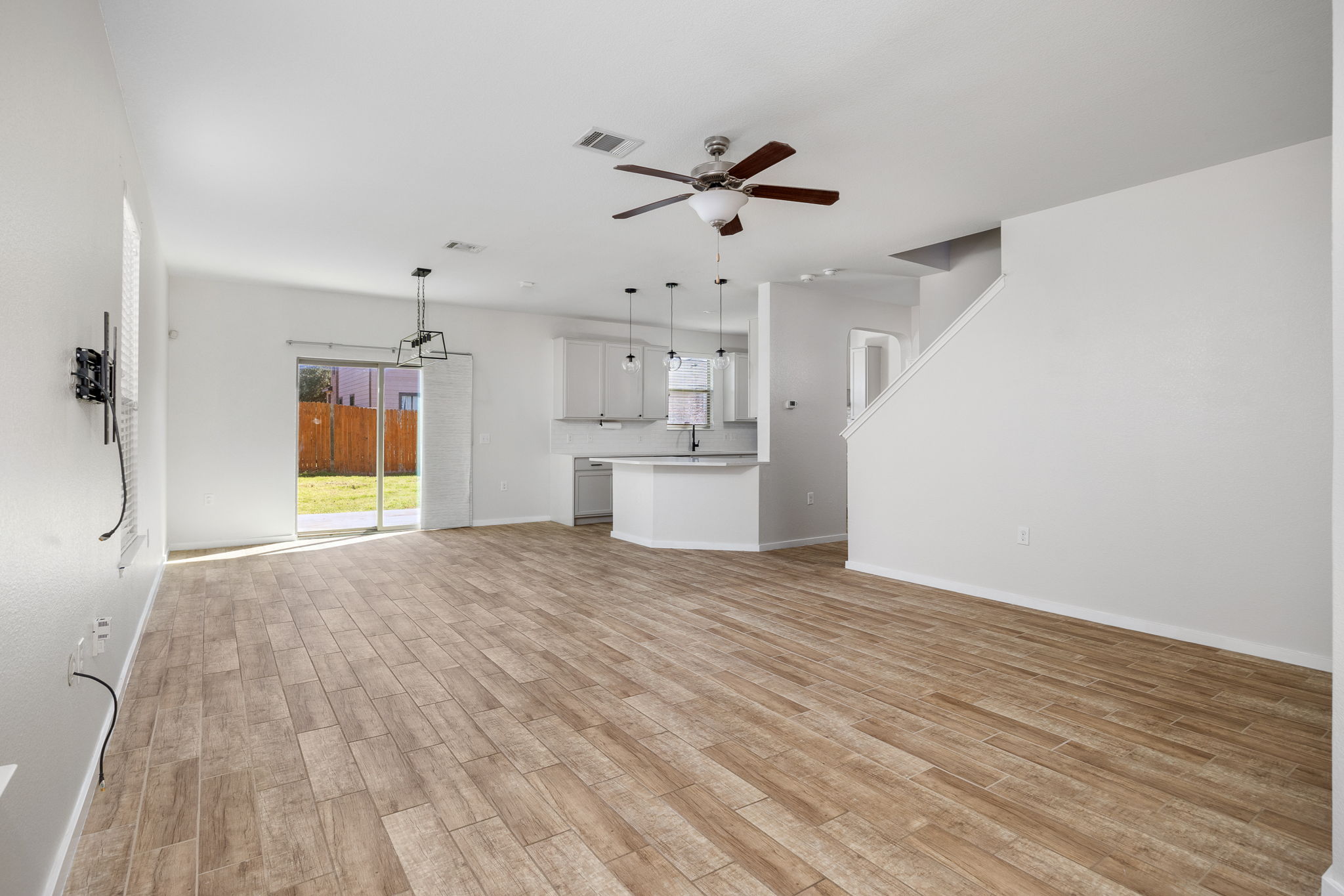 8909 Winter Haven Road Austin, TX 78747 - Photo 4 of 37 a view of empty room with wooden floor and window