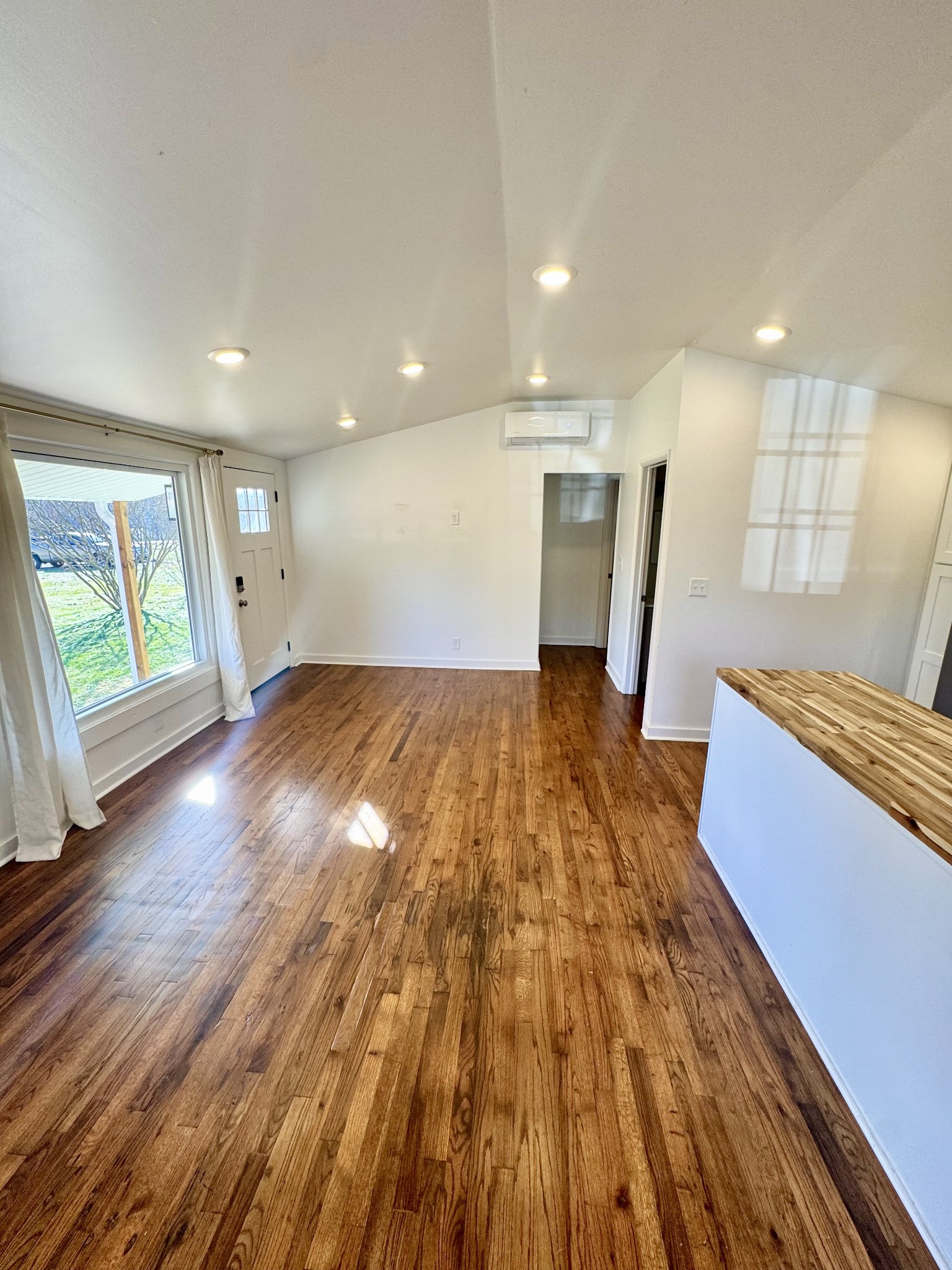 8649 Taliaferro Road Eagleville, TN 37060 - Photo 17 of 24 a view of empty room with wooden floor and fan