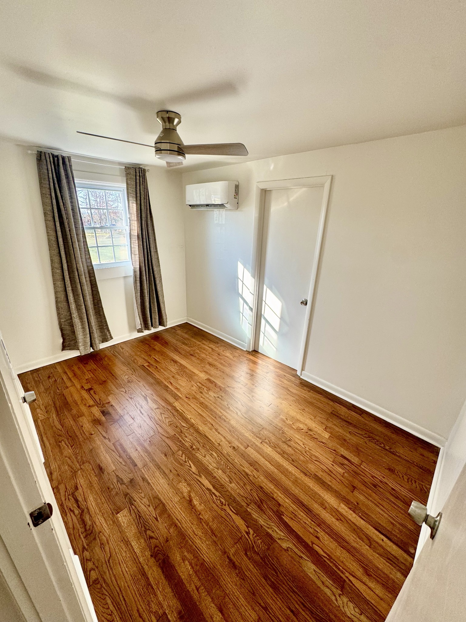 8649 Taliaferro Road Eagleville, TN 37060 - Photo 22 of 24 a view of a room with wooden floor and staircase