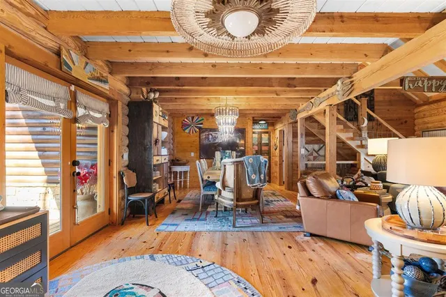a view of a kitchen with a table and chairs