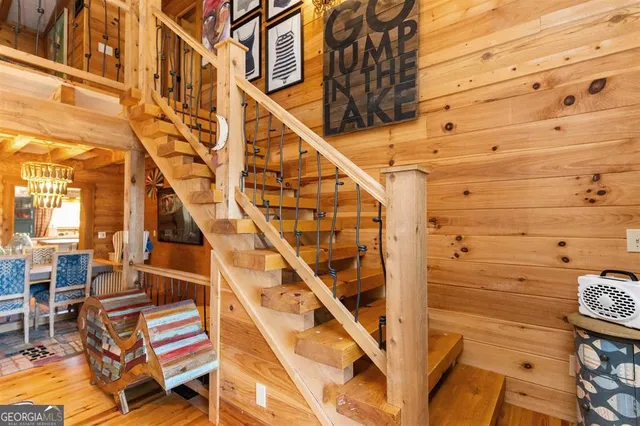 a view of a patio with table and chairs and wooden floor