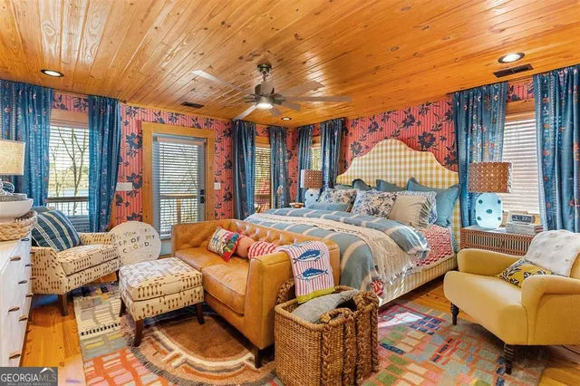 a bathroom with a sink toilet and shower curtain