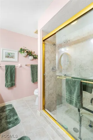 a bathroom with a glass shower door