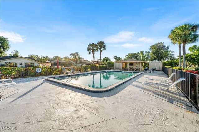 a view of a swimming pool with a patio
