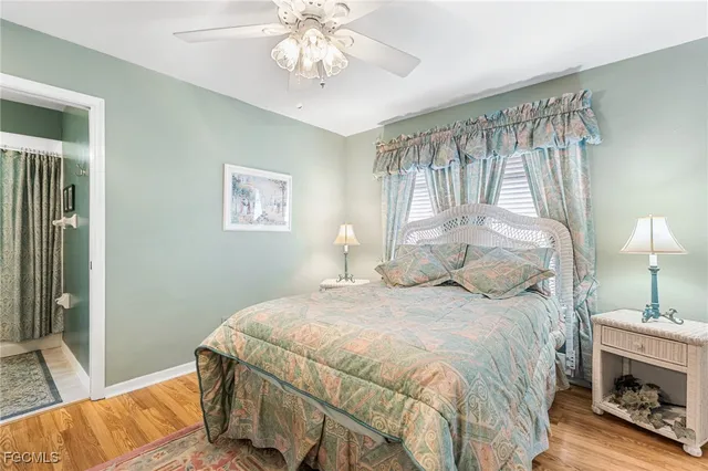 a bedroom with a bed and a fireplace