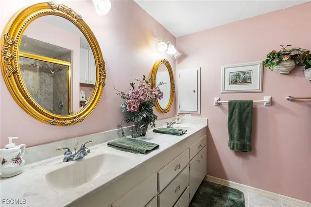 a bathroom with a double vanity sink and a mirror