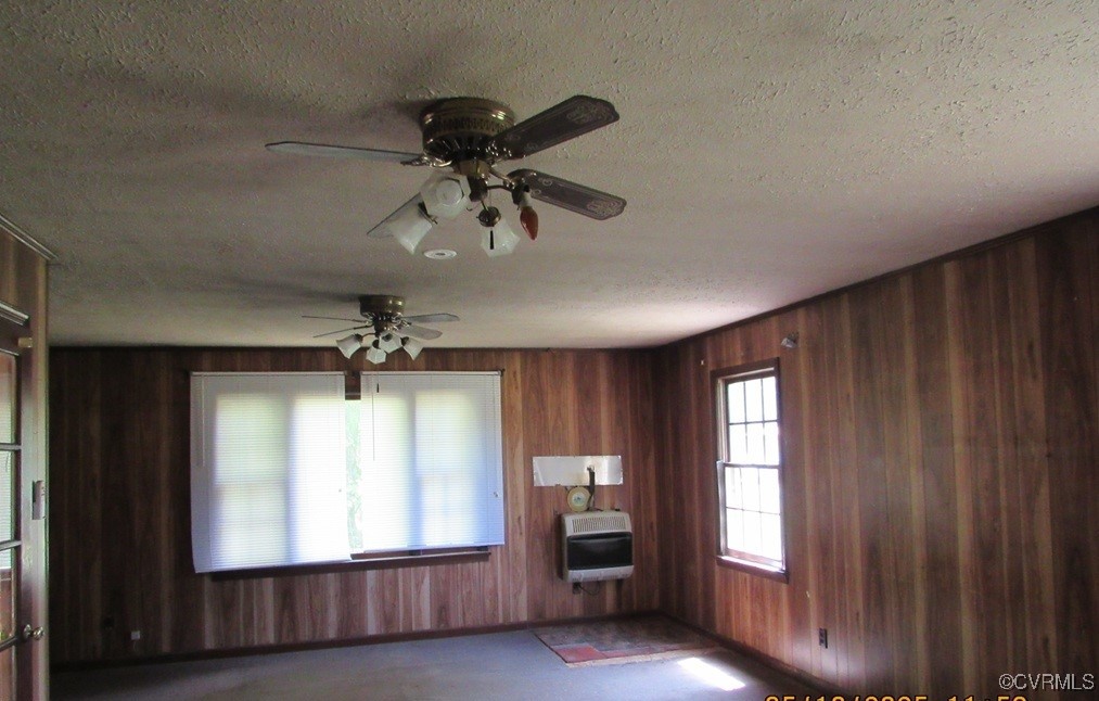 27701 Prince Edward Highway Rice, VA 23966 - Photo 11 of 21 Unfurnished living room featuring heating unit, wo