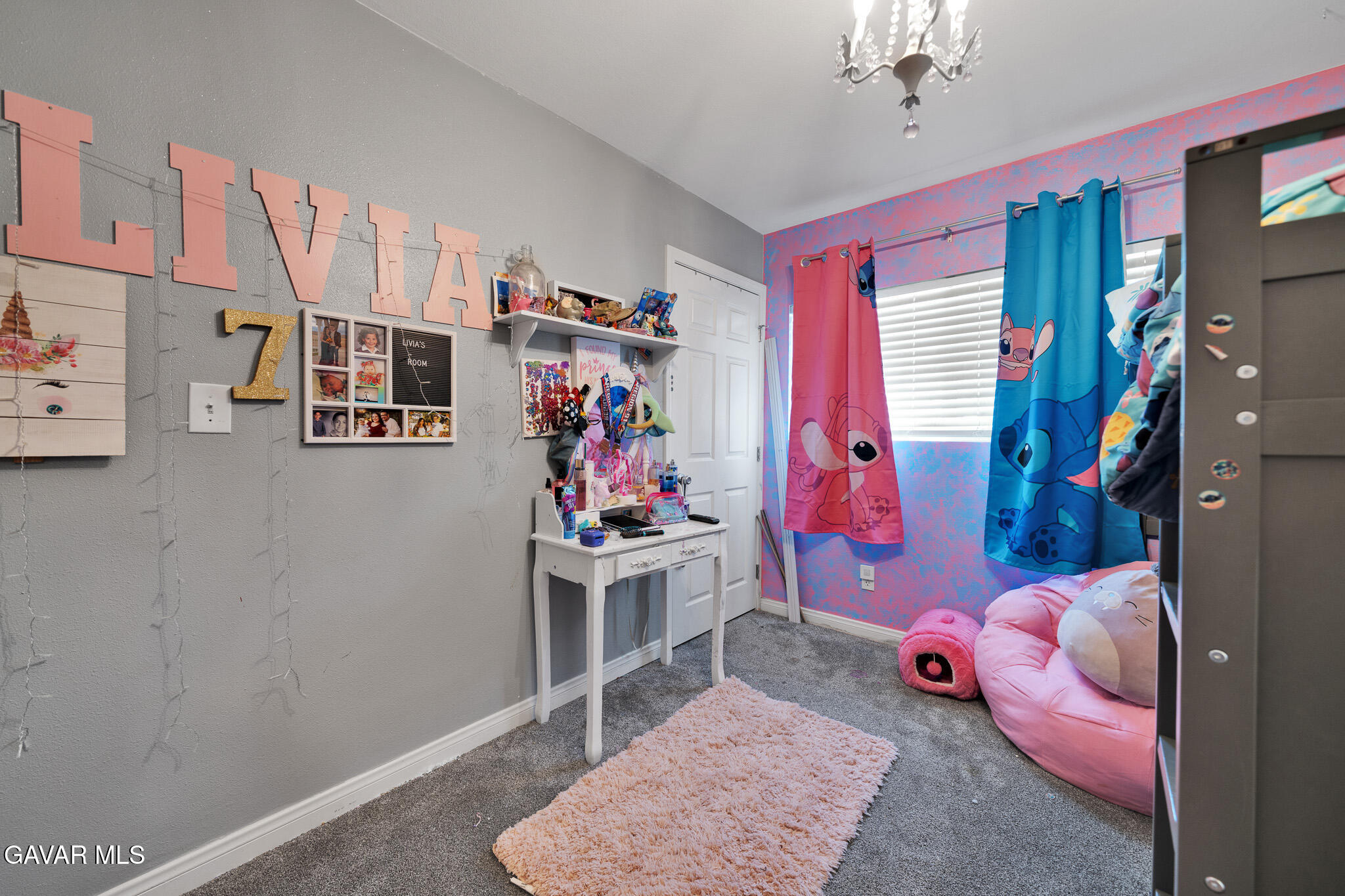44188 Glenraven Road Lancaster, CA 93535 - Photo 16 of 26 a living room with furniture and a window