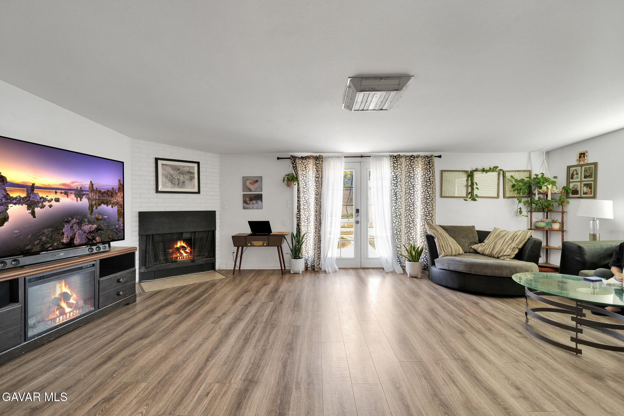 44188 Glenraven Road Lancaster, CA 93535 - Photo 21 of 26 a living room with furniture and a fireplace