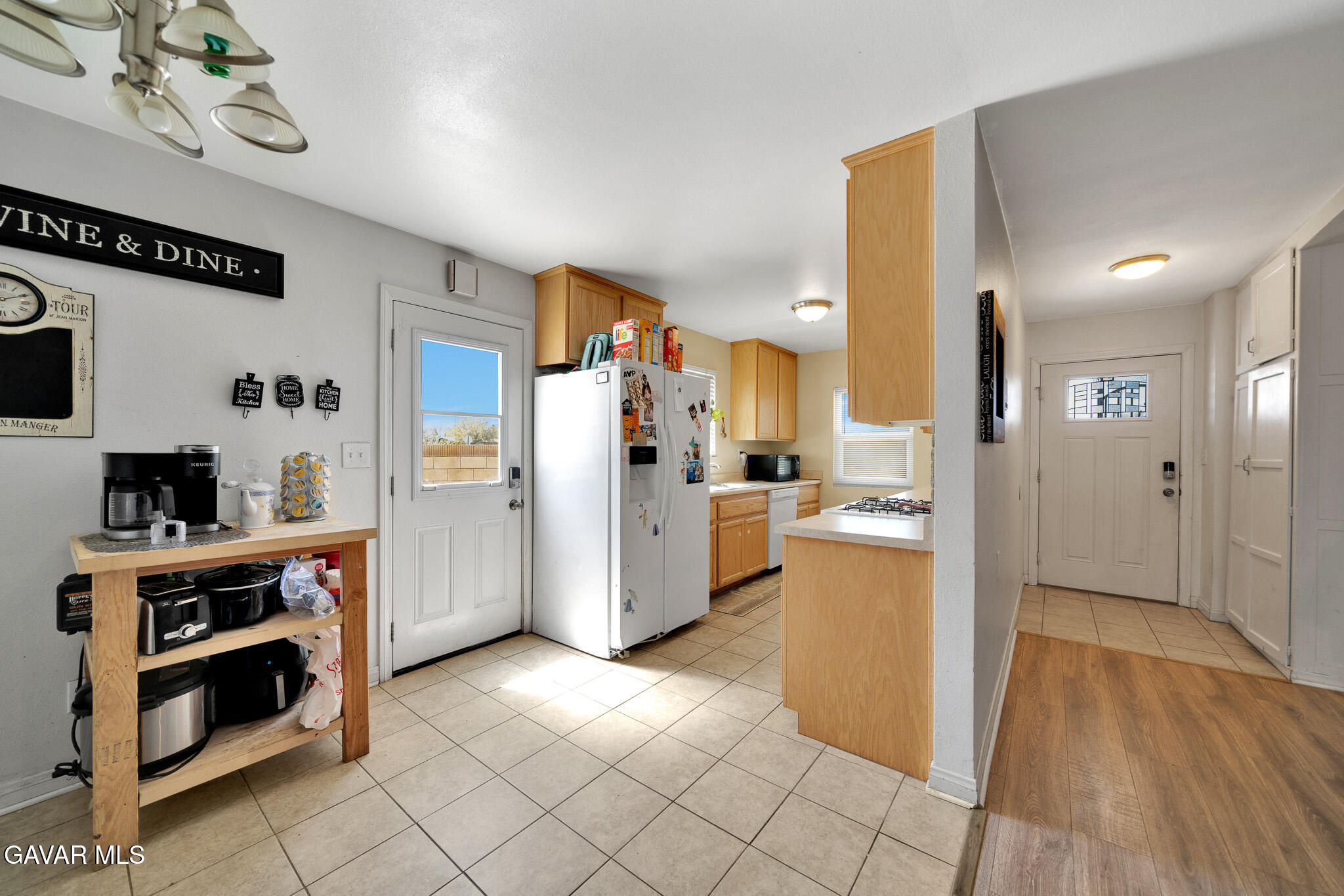44188 Glenraven Road Lancaster, CA 93535 - Photo 6 of 26 a kitchen with a refrigerator and a stove top oven
