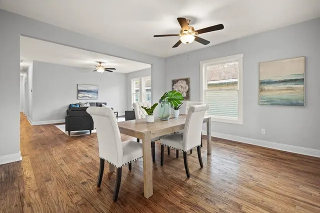 a dining room with furniture and window