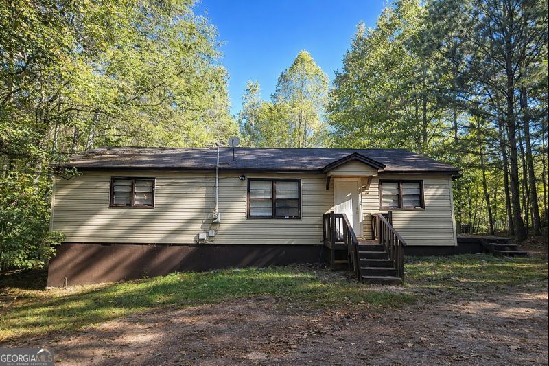 377 Dock Hyde Road Carrollton, GA 30116 - Photo 2 of 31 a front view of a house with garden