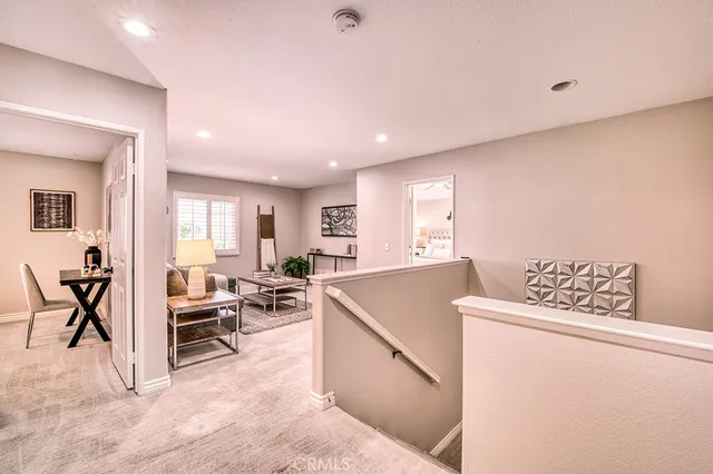 a view of a livingroom with furniture and a window