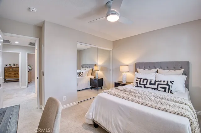 a bedroom with a bed and chair