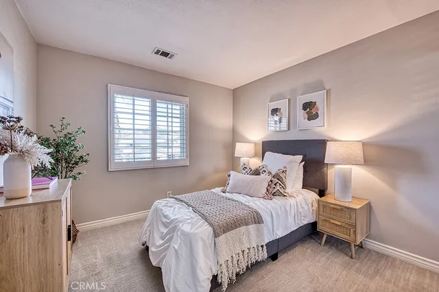 a view of a backyard with plants and patio