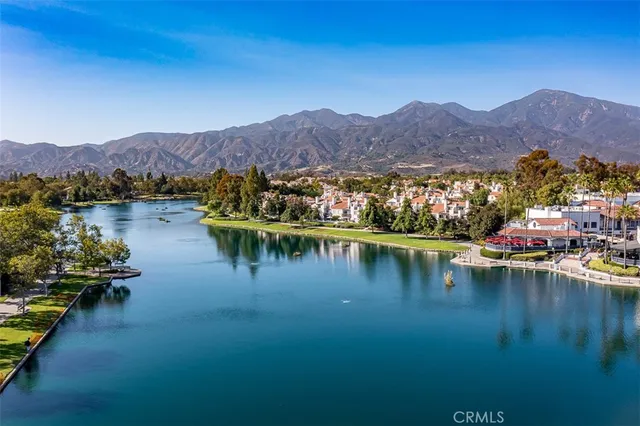 an aerial view of a house with a swimming pool
