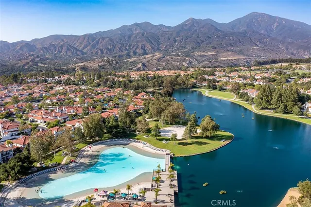 an aerial view of a house with a lake view