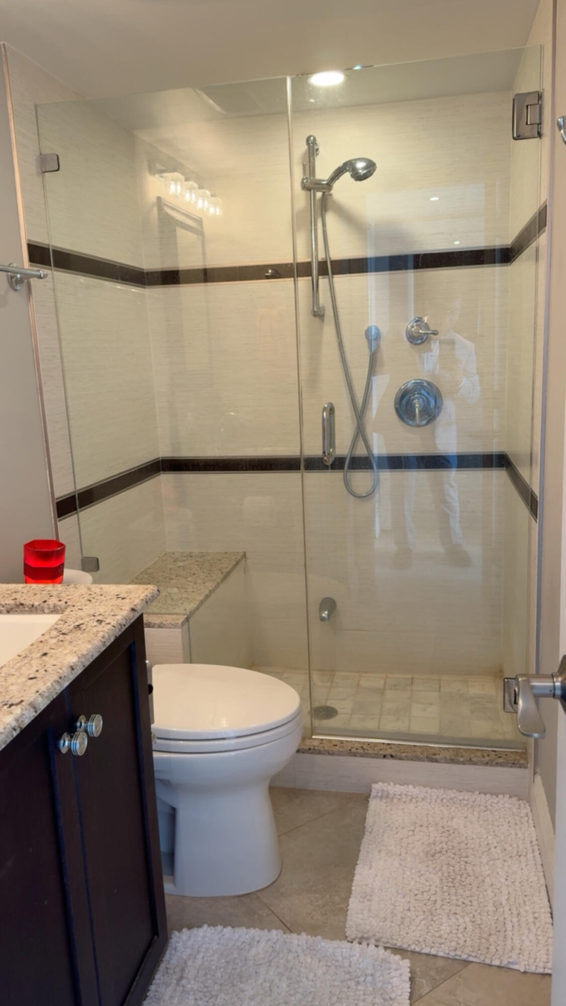 2611 North Riverside Drive, Unit 703 Pompano Beach, FL 33062 - Photo 66 of 81 a bathroom with a sink a toilet and shower