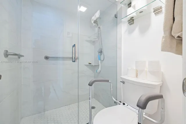 a bathroom with a toilet and shower