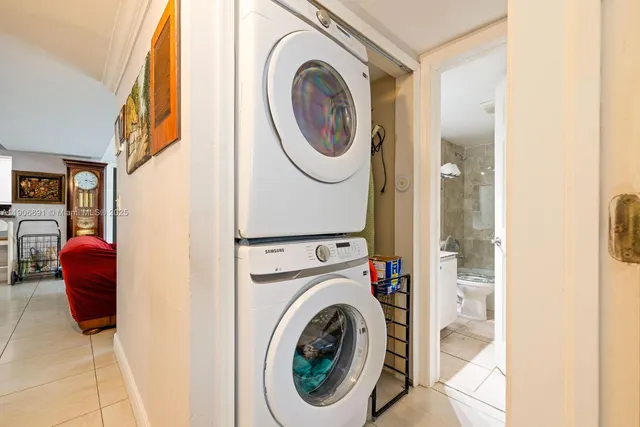 a view of a hallway with washer and dryer